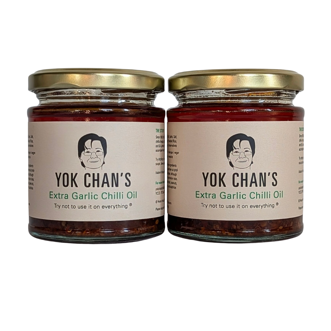 two jars of garlic chilli oil with a white background