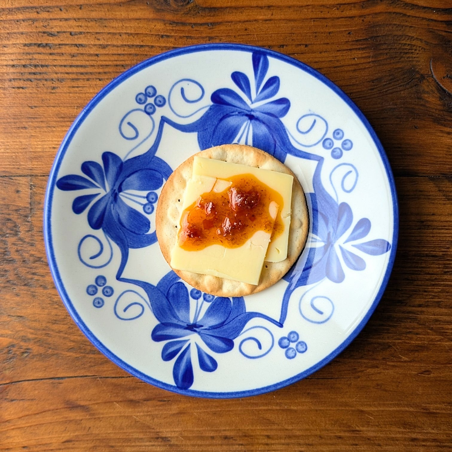 Small dessert on a blue and white decorative plate on a wooden table