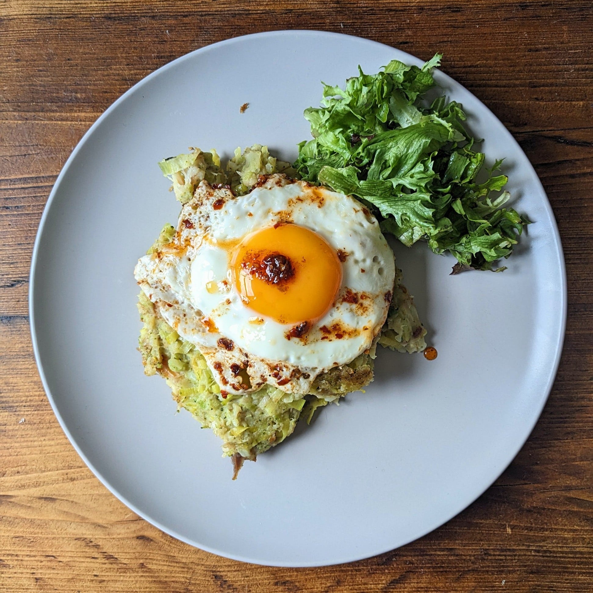 birds eye view of mackerel hash with a fried egg with chilli oil