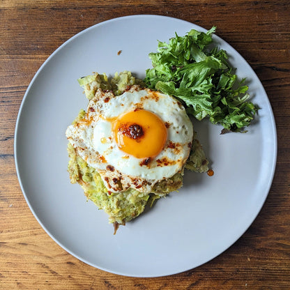 birds eye view of mackerel hash with a fried egg with chilli oil